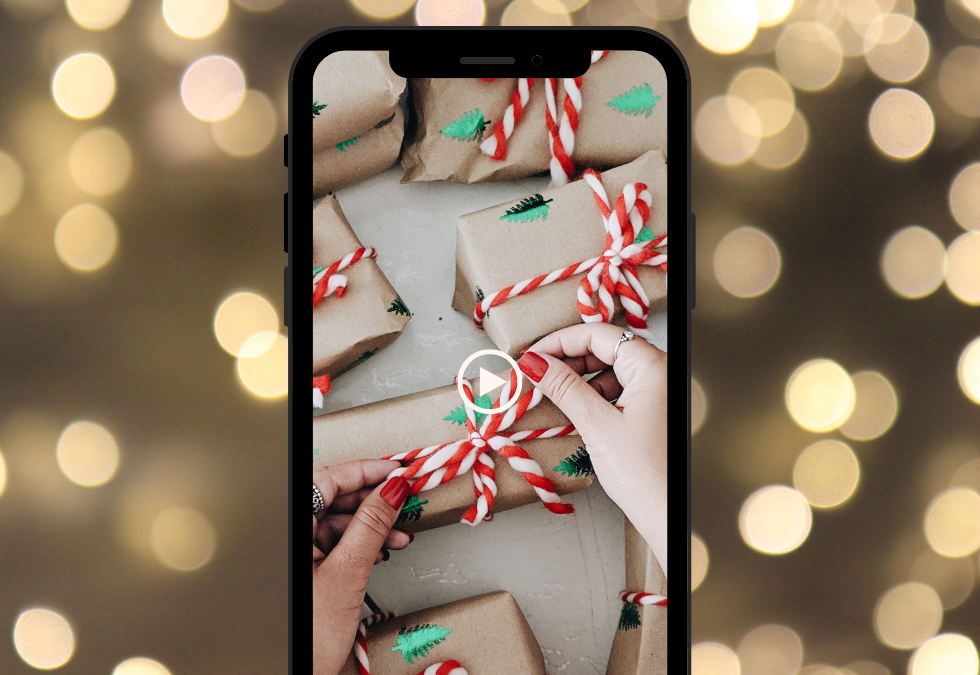 A phone with a reel loaded of holiday gift wrapping.